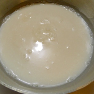 Heat the coconut milk until it just begins to simmer.